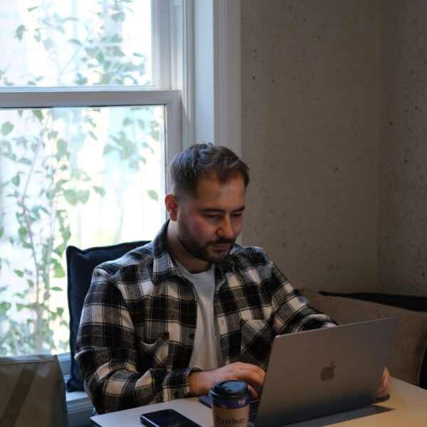 free-photo-of-a-man-sitting-at-the-desk-with-a-laptop.jpeg