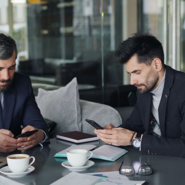 free-photo-of-businessmen-working-on-smartphones-over-a-coffee.jpeg