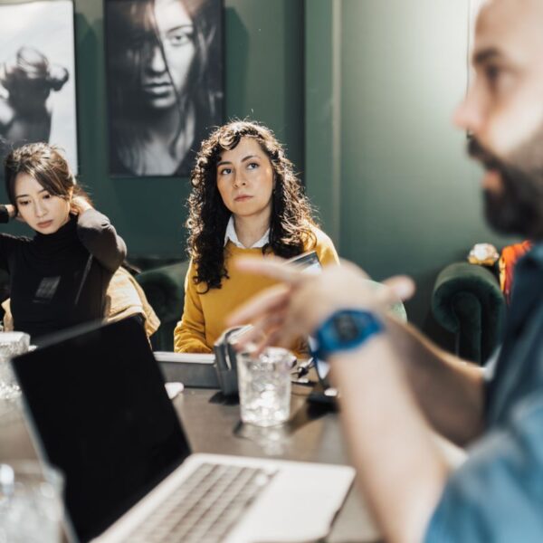 free-photo-of-women-and-man-sitting-by-table-with-laptop.jpeg